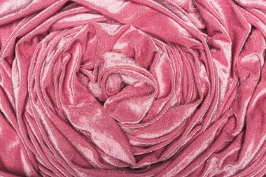 Pembe kadife kumaşın arka planının üst görüntüsü