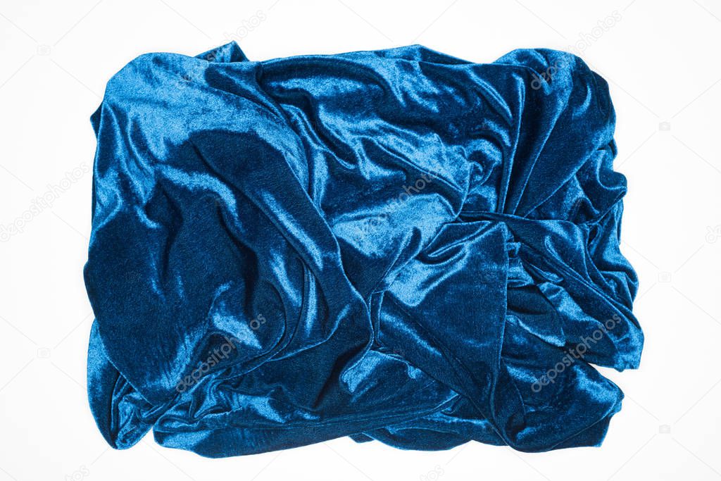Top view of crumpled blue fabric isolated on white