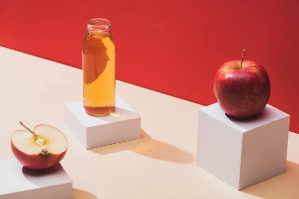 Fresh Juice Bottle Apples White Cubes Red Background — Stockfoto