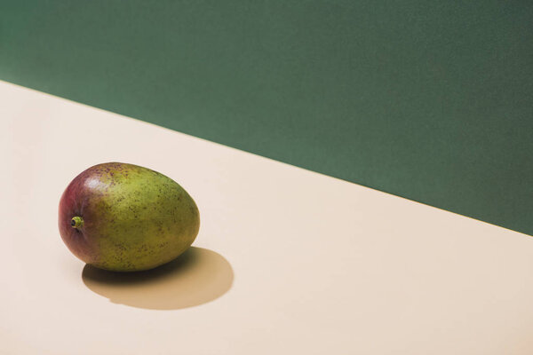 fresh mango on green and white background