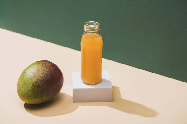 Fresh Juice Bottle Mango White Cube Green Background — Stok fotoğraf