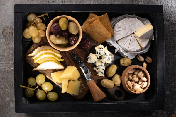 Top View Different Kinds Cheese Fruits Nuts Knife Tray Grey — Stock Photo, Image