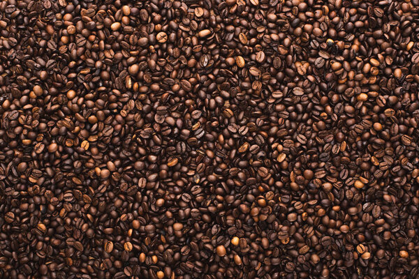 top view of fresh roasted coffee beans background