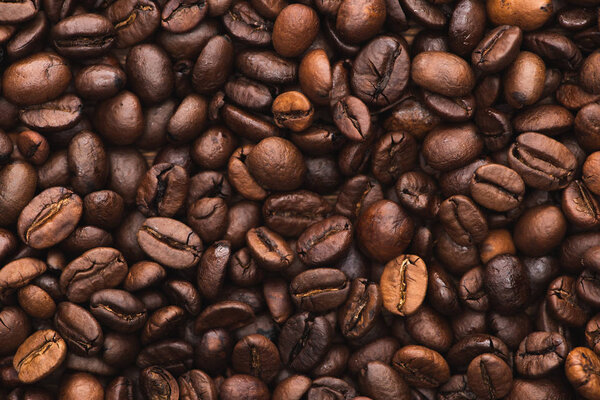top view of fresh roasted coffee beans background