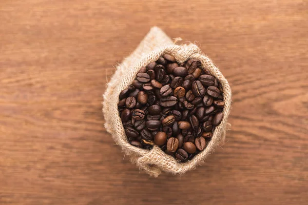 Selective Focus Fresh Roasted Coffee Beans Sack Wooden Surface — Stock Photo, Image