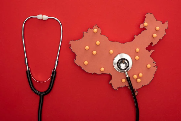 Top View Map China Push Pins Stethoscope Red Background — Stock Photo, Image