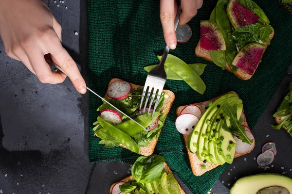 Cropped View Woman Eating Radish Sandwiches Fork Knife — Stock Photo, Image