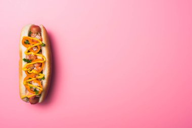 top view of tasty hot dog on pink with copy space clipart