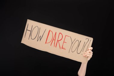 Partial view of woman holding placard with how dare you lettering isolated on black, global warming concept clipart