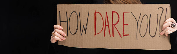 Panoramic view of woman with placard with how dare you lettering isolated on black, global warming concept