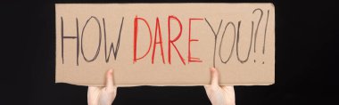 Panoramic view of woman holding placard with how dare you lettering isolated on black, global warming concept clipart