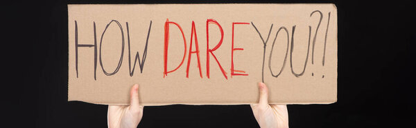 Panoramic view of woman holding placard with how dare you lettering isolated on black, global warming concept
