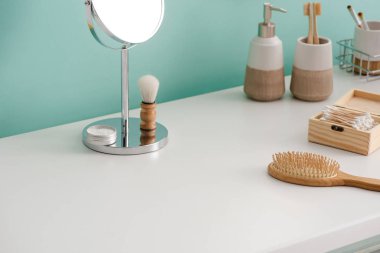 Various beauty and hygiene objects with round mirror in bathroom, zero waste concept clipart