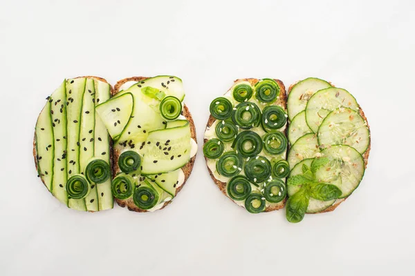 Top View Fresh Cucumber Toasts Seeds Mint Basil Leaves White — Stock Photo, Image