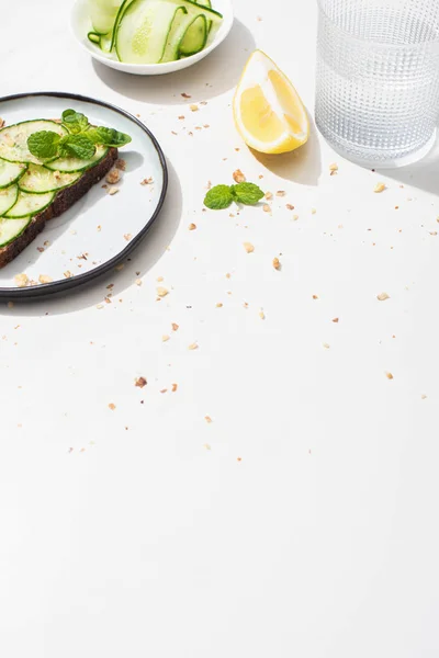 Fresh Cucumber Toast Seeds Served Lemon Water White Background — Stock Photo, Image