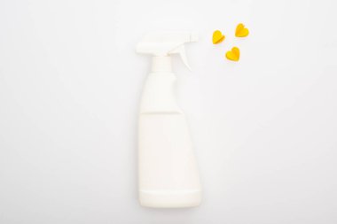 top view of spray bottle with yellow hearts on white background clipart