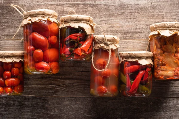 Top View Red Homemade Tasty Pickles Jars Wooden Table — Stock Photo, Image