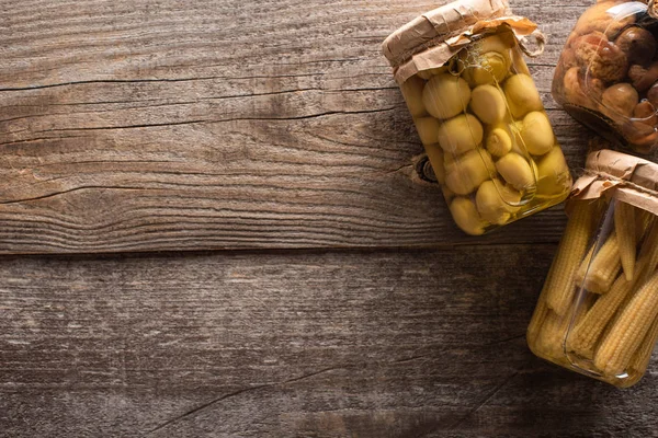 Top view of delicious homemade tasty pickled corn and mushrooms on wooden rustic table — Stock Image Top View Delicious Homemade Tasty Pickled Corn Mushrooms Wooden Rustic Stock Picture