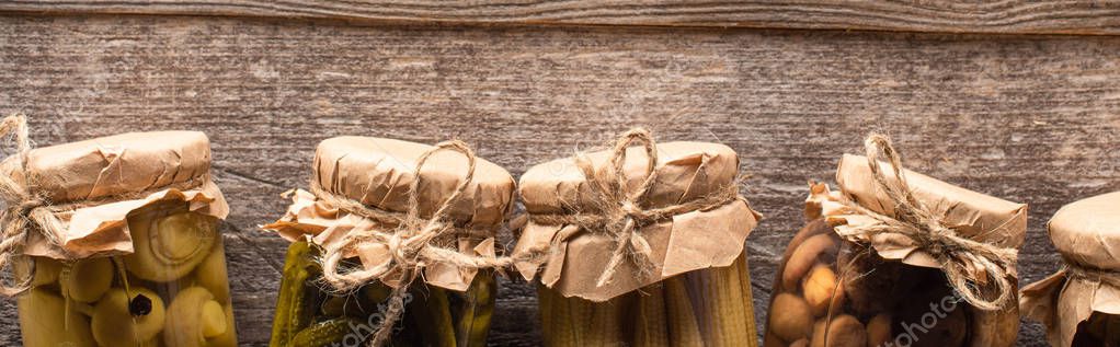 Top view of homemade pickles in jars on wooden table with copy space, panoramic shot — Stock Image Top View Homemade Pickles Jars Wooden Table Copy Space Panoramic Royalty Free Stock Photos