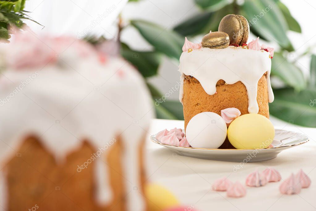 selective focus of Easter cakes with white glaze and meringue