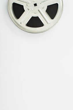 top view of old film reel on white background clipart