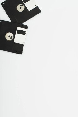 top view of two floppy disks on white background clipart