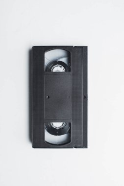 top view of old black VHS cassette on white background clipart