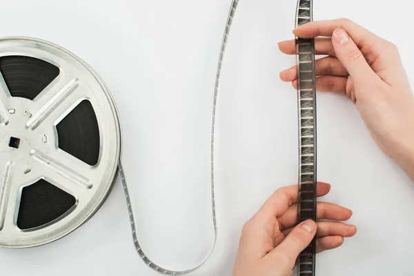 stock image partial view of man holding film strip on white background