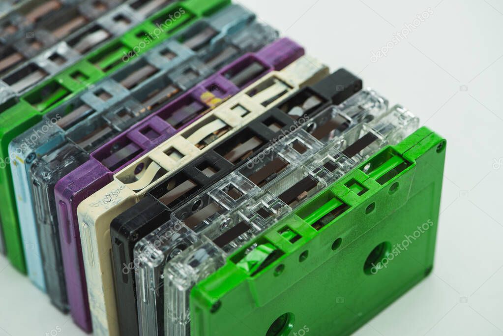 high angle view of colorful recording cassettes on white background