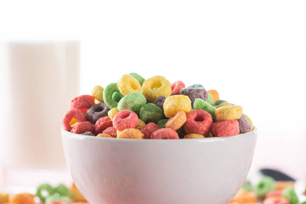 selective focus of bright multicolored breakfast cereal in bowl