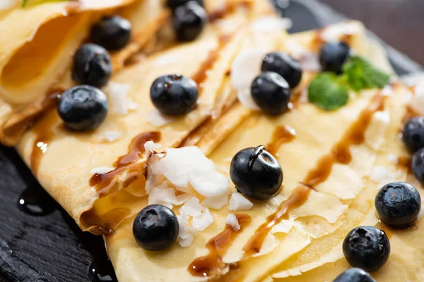 Close View Tasty Crepes Blueberries Mint Coconut Flakes — Stock Photo, Image