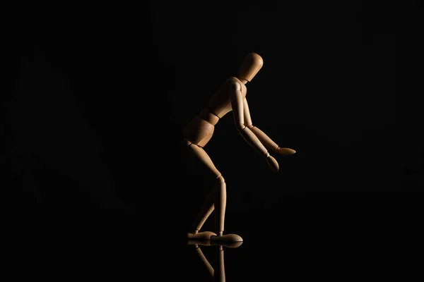 Wooden Doll Outstretched Hands Leaning Position Black Background — Stock Photo, Image