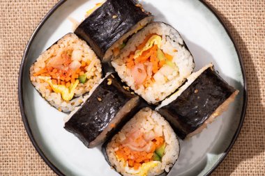 top view of plate with tasty korean gimbap  clipart
