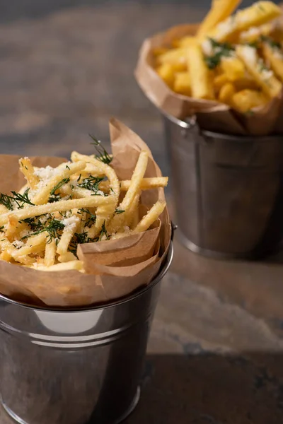 Selective focus of bucket with crispy french fries on marble surface — Stock Image Selective Focus Bucket Crispy French Fries Marble Surface Royalty Free Stock Images