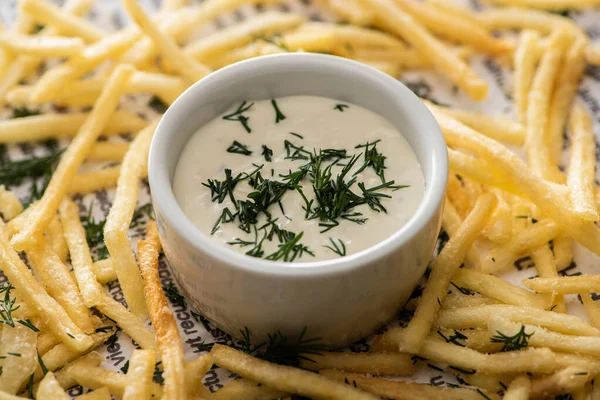 Close up of creamy garlic sauce with dill near crispy french fries — Stock Image Close Creamy Garlic Sauce Dill Crispy French Fries Stock Image