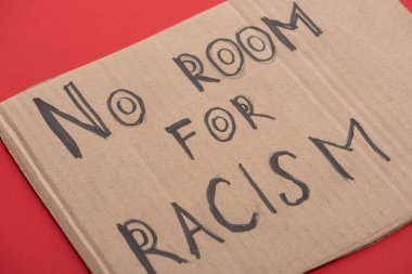 carton placard with say no room for racism lettering on red background clipart
