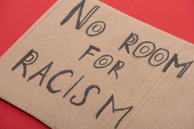 carton placard with say no room for racism lettering on red background clipart