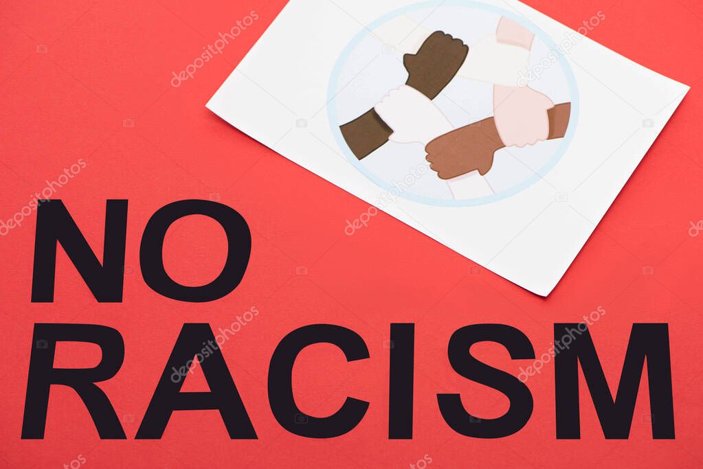 black no racism lettering and picture with drawn multiethnic hands united on red background