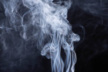 abstract white flowing smoke on black background clipart