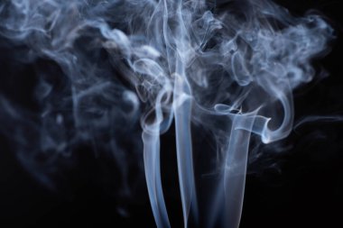 white flowing smoke on black background clipart