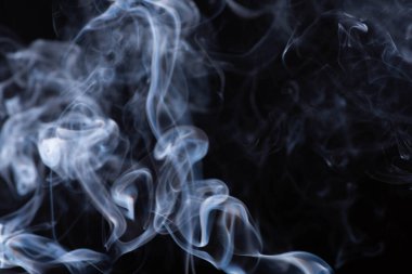 white flowing smoke cloud on black background clipart
