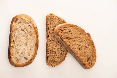 top view of fresh whole grain bread slices on white background clipart