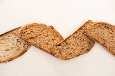 top view of whole grain bread slices on white background clipart