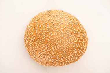 top view of fresh bun with sesame on white background clipart