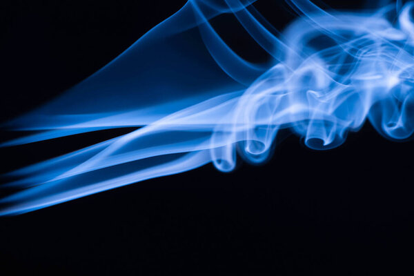 blue colorful flowing smoke on black background