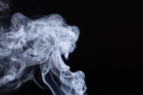 abstract white flowing smoke clouds on black background