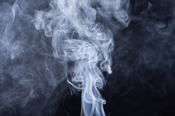 abstract white flowing smoke on black background
