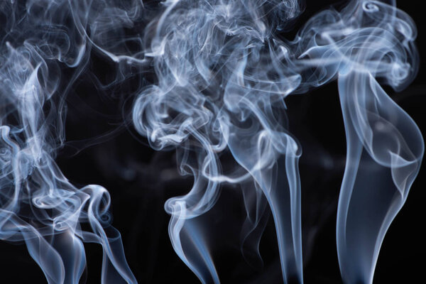 abstract white flowing smoke on black background