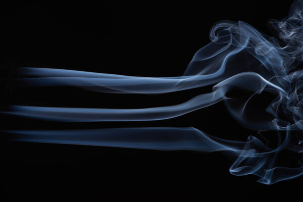 white flowing smoke cloud on black background