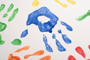 top view of colorful hand prints on white for World Autism Awareness Day  clipart